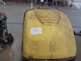 a yellow machine that is sitting on the floor