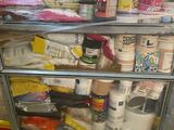 a metal cart with many items on it in a room