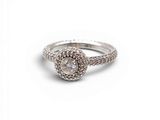 a close up of a diamond ring on a white background
