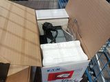 a box that is sitting on the ground next to a carton