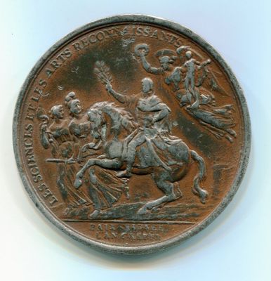 une vieille pièce de monnaie sur laquelle figure l'image d'un homme à cheval