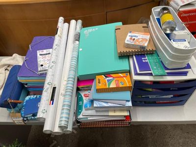 a table with a lot of school supplies on it