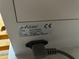 an image of a close up of a machine with a cord attached