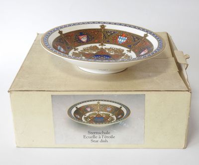 a box with a bowl on top of it on a table