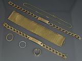 several pieces of gold jewelry including a bracelet, bracelet, and ring
