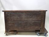 an old wooden box with wheels on a white background