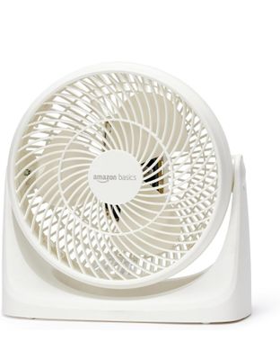 a white fan that is sitting on top of a table