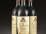 three bottles of wine sitting on top of a table next to each other