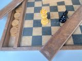 a chess board with a black and yellow chess piece on it