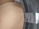 a tire that has been wrapped up and is sitting in a box