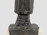 an image of a sculpture of a tree stump on a marble base