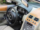 the interior of a car with a tan leather dashboard and tan leather seats