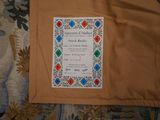 a picture of a wedding invitation sitting on a bed