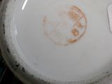 a plate with a tag on it sitting on a table