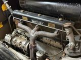 a close up view of an old engine in the back of a truck