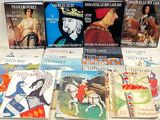 a lot of books that are on the table