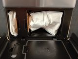 a black and white photo of a microwave with a paper towel in it