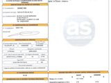 un gros plan d'un document sur lequel figure la photo d'une voiture