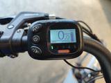 a close up view of a bike ' s handlebar with a speedometer