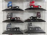 a lot of toy trucks on display in a case
