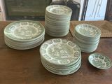 a lot of plates that are sitting on a table