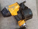two power tools that are laying on the ground