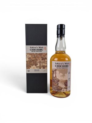 a bottle of whisky in front of a black box