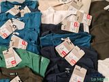 a pile of clothing with price tags on them