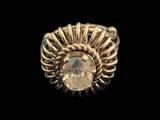 a close up of a ring with a stone in it