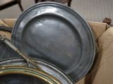 two pans sitting on top of a cardboard box
