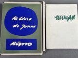 an open book with a picture of a blue circle and a white book with a green circle