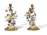 pair of antique porcelain candlesticks with figures and flowers