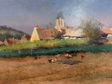 un tableau représentant des vaches dans un champ, avec une église en arrière-plan