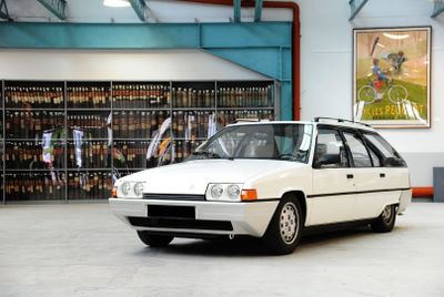 a white car that is parked in a garage
