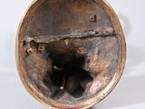 a bronze sculpture of a bear inside of a bowl