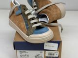 a pair of shoes that are on top of a box