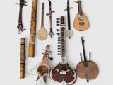 several musical instruments are arranged on a white surface