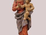 a statue of a woman holding a baby in her arms
