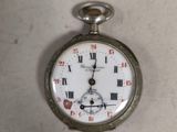 a silver pocket watch with roman numerals on it