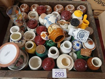 many cups and saucers on display in a box
