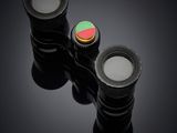 two lenses are sitting on top of each other on a black surface