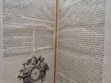 an open book with a picture of a clock on it