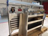a metal shelf with several drawers on it in a warehouse