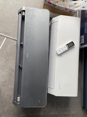 two laptops that are sitting next to each other on the floor