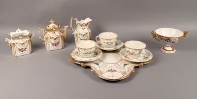 many pieces of porcelain on display on the table