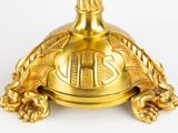 a gold turtle shaped candle holder on a white background