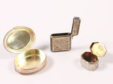 a small silver box with a lid and a small silver box with an open lid