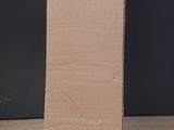 a cardboard box sitting on top of a wooden table
