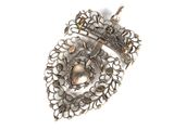 an antique silver broochle on a white background with a white background