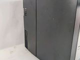 a black desktop computer sitting on a white surface